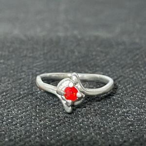 Thin ring with a red gem